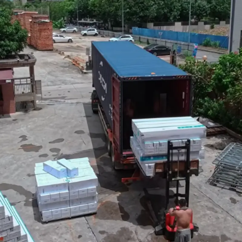 The mattresses are being loaded into the container